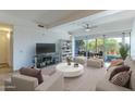 Bright living room with stylish furniture, large windows, and access to the outdoor patio at 7167 E Rancho Vista Dr # 2007, Scottsdale, AZ 85251