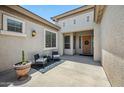 Inviting front porch with stylish decor, a cozy seating area, and a welcoming entrance at 8417 W Northview Ave, Glendale, AZ 85305