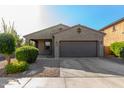 Charming single-story home with well-maintained landscaping and a two-car garage at 865 E Del Rio St, Chandler, AZ 85225