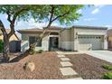 Inviting single-story home with neutral tones, desert landscaping, and a spacious two-car garage at 8758 W Myrtle Ave, Glendale, AZ 85305