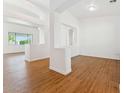 Bright living room with beautiful wood floors and plenty of natural light at 8758 W Myrtle Ave, Glendale, AZ 85305