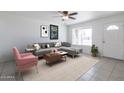 Bright living room with stylish furnishings, neutral decor, and plenty of natural light at 929 W Knowles Cir, Mesa, AZ 85210