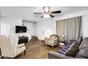 Bright living area with hardwood floors, neutral paint, and comfortable seating at 1032 E Redfield Rd, Tempe, AZ 85283