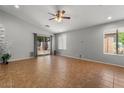 Spacious living room featuring neutral walls and sliding glass doors overlooking the backyard at 10646 E Enid Ave, Mesa, AZ 85208