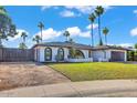 Charming single-Gathering home featuring a lush lawn, desert landscaping, and timeless architectural detail at 10844 N 37Th Way, Phoenix, AZ 85028