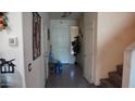 Entrance foyer with tile floors, a staircase, and natural light at 1309 W Park St, Phoenix, AZ 85041