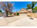 This well-maintained house has a two-car garage and desert landscaping in a well manicured neighborhood at 18805 N 49Th Dr, Glendale, AZ 85308