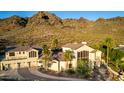 Aerial view of the home showing the roofline, driveway, and desert landscaping at 2326 E Gardenia Dr, Phoenix, AZ 85020