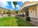 Cozy backyard patio with dining table and desert landscaping at 2326 E Gardenia Dr, Phoenix, AZ 85020