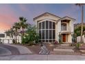 Elegant two-story home features a beautiful front yard, desert landscaping, and stylish architectural details at 2326 E Gardenia Dr, Phoenix, AZ 85020