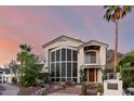 Elegant two-story home features a beautiful front yard, desert landscaping, and stylish architectural details at 2326 E Gardenia Dr, Phoenix, AZ 85020