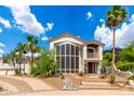 Elegant two-story home features a beautiful front yard, desert landscaping, and stylish architectural details at 2326 E Gardenia Dr, Phoenix, AZ 85020