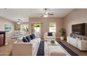 Inviting living room with stylish white furniture, tile floors, and modern decor at 2487 S Conestoga Rd, Apache Junction, AZ 85119