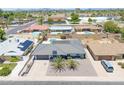 An aerial view showcases a well-maintained home, mature landscaping, and a private backyard oasis at 310 E Fremont Dr, Tempe, AZ 85282