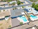Aerial view of a home featuring a backyard with a private pool, covered patio, and ample space at 310 E Fremont Dr, Tempe, AZ 85282