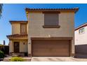 Charming two-story home with a two-car garage, tidy yard, and lovely curb appeal at 3235 S Bowman Rd, Apache Junction, AZ 85119
