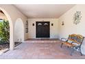 Inviting front entrance with double doors, tiled floor and a sitting bench at 3357 N Ashbrook E St, Mesa, AZ 85213
