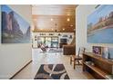 View of the spacious living room with wood ceilings and access to the outdoor living area at 3357 N Ashbrook E St, Mesa, AZ 85213
