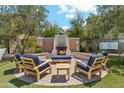 Outdoor fireplace with seating area, perfect for entertaining or relaxing with Gathering and friends at 3900 E Baseline Rd # 166, Phoenix, AZ 85042