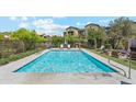 Community swimming pool with lounge chairs, perfect for enjoying the warm weather at 3900 E Baseline Rd # 166, Phoenix, AZ 85042
