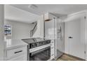 Open concept kitchen with stainless steel appliances and quartz countertops at 4714 E Broadway Rd, Phoenix, AZ 85040