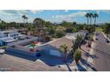 Aerial view of a home with a backyard pool, desert landscaping and a privacy fence at 501 W Jasper Dr, Chandler, AZ 85225