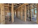 Framing displays open-concept design, emphasizing the layout and potential flow between rooms and natural light at 11417 E Utah Ave, Mesa, AZ 85212