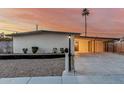 Well-maintained single-story home features desert landscaping and a convenient covered parking area at 1258 E Campus Dr, Tempe, AZ 85282