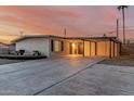 Charming single-story home features a spacious driveway and covered parking in a well-lit neighborhood at 1258 E Campus Dr, Tempe, AZ 85282