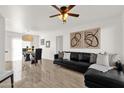 Bright living room and dining area with stylish furnishings, ceiling fan, and decorative accents at 13636 N Saguaro Blvd # 103, Fountain Hills, AZ 85268