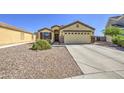 Inviting single-Gathering home features desert landscaping and a spacious two-car garage at 24035 W La Salle St, Buckeye, AZ 85326