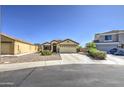 Charming single-Gathering home with desert landscaping, paved driveway and well-maintained lawn at 24035 W La Salle St, Buckeye, AZ 85326