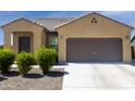 Charming single-story home with a two car garage and low maintenance desert landscaping at 2430 E Alonso Dr, Casa Grande, AZ 85194