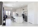 Bright open-concept kitchen with granite countertops and stainless steel appliances at 2430 E Alonso Dr, Casa Grande, AZ 85194