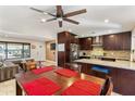 Open-concept kitchen featuring dark wood cabinets and granite countertops at 2525 E Nisbet Rd, Phoenix, AZ 85032