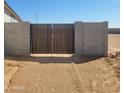 Secure backyard gate, providing access with privacy and style at 25489 W Fraktur Rd Rd, Buckeye, AZ 85326