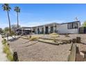 Exterior shot of home with carport and desert landscaping at 2956 E Sequoia Dr, Phoenix, AZ 85050