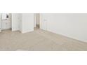 Hallway view featuring neutral carpet, white walls and a view to another room at 37168 W Prado St, Maricopa, AZ 85138