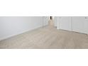 Neutral carpeting and white trim create a clean and bright bedroom space, with convenient closet access at 37198 W Vera Cruz Dr, Maricopa, AZ 85138
