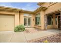 Inviting home exterior showcasing desert landscaping, stone accents, and a convenient side garage at 41819 N Anthem Ridge Dr, Phoenix, AZ 85086