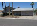 Charming single-story home with a well-maintained yard and mature trees at 4550 W Cinnabar Ave, Glendale, AZ 85302