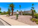 Attractive home exterior featuring desert landscaping, cactus and gravel accents at 6119 E Sandra Ter, Scottsdale, AZ 85254