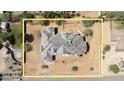 Aerial view of a home under construction with a yellow outline, showcasing the roof and lot size at 8125 E Gail Rd, Scottsdale, AZ 85260