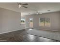 Bright living room featuring sleek floors, ceiling fans, and scenic views at 8256 W Mccartney Rd, Casa Grande, AZ 85194
