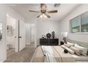 Neutral Primary bedroom with a large window, a ceiling fan, and a modern dresser at 1028 W 5Th St, Mesa, AZ 85201