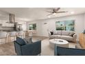 Bright, open-concept living space featuring modern furnishings and seamless flow to the updated kitchen at 1028 W 5Th St, Mesa, AZ 85201