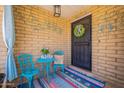 Charming front porch with colorful decor and a welcoming atmosphere at 1186 E Brenda Dr, Casa Grande, AZ 85122