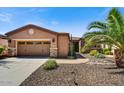 Inviting single-story home with a two-car garage and desert landscaping at 12903 W Brookhart Way, Peoria, AZ 85383