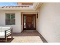 Inviting front door with glass sidelights and stylish brick-paved entryway at 13010 S 42Nd St, Phoenix, AZ 85044