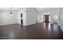 Spacious living room features wood-look tile flooring and plenty of natural light at 13010 S 42Nd St, Phoenix, AZ 85044